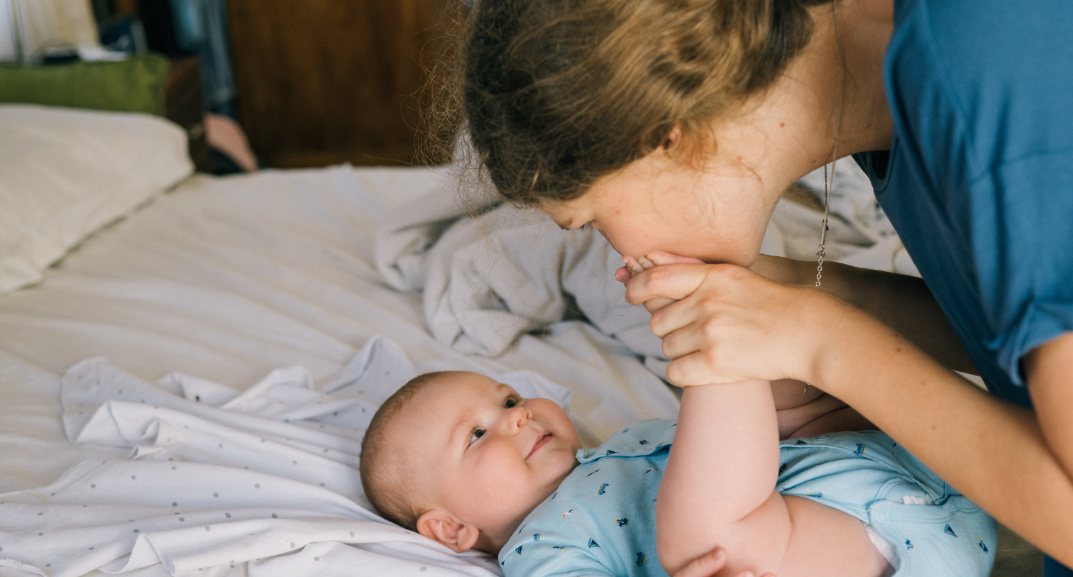 A Mother Kissing Her Baby's Feet