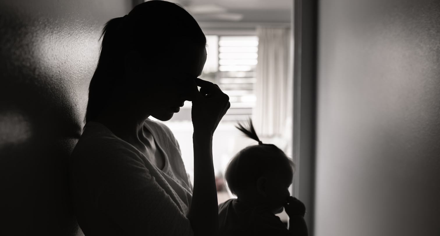Stressed mother with her daughter at home