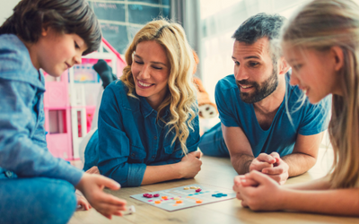 family playing board games on the floor having a happy time